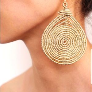 Gold spiral spring statement earrings